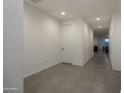 Neutral hallway featuring tiled floor and access to rooms with recessed lighting at 6732 W Pedro Ln, Laveen, AZ 85339