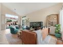 Open living room with high ceilings, modern decor, and seamless indoor-outdoor flow at 7344 E Nopal Ave, Mesa, AZ 85209