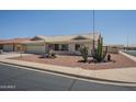 Charming single-story home with desert landscaping, tile roof, and attached two-car garage at 7925 E Monte Ave, Mesa, AZ 85209