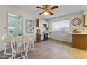 Bright eat-in kitchen featuring an integrated workspace and abundant natural light at 9202 N 107Th Ave, Sun City, AZ 85351