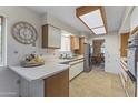 Well-lit kitchen featuring ample counter space and classic white cabinetry at 9202 N 107Th Ave, Sun City, AZ 85351