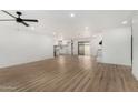 Bright living room featuring hardwood floors and an open floor plan at 14017 N 40Th Ave, Phoenix, AZ 85053