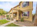 Charming two-story home featuring a welcoming porch, colorful shutters, and well-maintained landscaping at 2873 S Arroyo Ln, Gilbert, AZ 85295