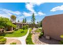 Manicured Winfield Place grounds featuring lush greenery, walking path, and serene landscaping at 7436 E Chaparral Rd # 159B, Scottsdale, AZ 85250