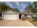 Welcoming single-level home with attached garage, manicured yard, and inviting entryway at 1014 W Hononegh Dr, Phoenix, AZ 85027