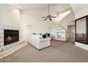 Cozy living room featuring a fireplace, built-in shelving, and a comfortable sofa at 10235 N 31St St # 17, Phoenix, AZ 85028