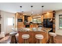 Well-equipped kitchen featuring granite countertops, breakfast bar seating, and stainless-steel appliances at 10896 N 105Th Way, Scottsdale, AZ 85259