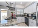 Modern kitchen featuring sleek countertops, stainless steel appliances, and ample cabinet space at 1216 E Ormondo Way, Phoenix, AZ 85014