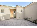 Inviting front courtyard with paver flooring leading to the front door at 17324 E Quail Track Rd, Rio Verde, AZ 85263