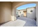 Beautiful covered courtyard with pavers and a view of the home's entry at 17324 E Quail Track Rd, Rio Verde, AZ 85263