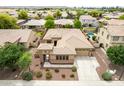 Spacious home featuring a private pool, mature landscaping, and a three-car garage at 1933 E Lafayette Ave, Gilbert, AZ 85298