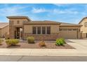 Charming single-story home with a well-manicured front yard and a gated front porch at 1933 E Lafayette Ave, Gilbert, AZ 85298
