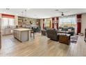 Spacious open-concept living area that connects to the kitchen and dining area, great for entertaining at 20181 N Lauren Rd, Maricopa, AZ 85138