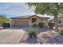 Beautiful single-story home with stone accents and mature landscaping at 241 W Atlantic Dr, Casa Grande, AZ 85122
