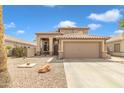 Attractive two-story home showcasing desert landscaping and a spacious two-car garage at 2859 E Cathy Dr, Gilbert, AZ 85296