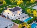 Aerial view of a home with solar panels, swimming pool, and green landscaping, providing a private backyard oasis at 2973 E Austin Dr, Gilbert, AZ 85296