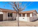 Front exterior view of home with neutral stucco, brick walkway, and mature trees at 3941 W Desert Hills Dr, Phoenix, AZ 85029