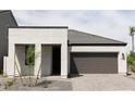 Single-story home with a two-car garage, desert landscaping, and a modern design at 5928 S Daisy Patch Pl, Phoenix, AZ 85040