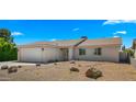 Single-story home showcasing desert landscaping, gravel, rocks, and cacti in the front yard at 6833 E Grandview Dr, Scottsdale, AZ 85254