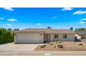 Charming single-story home featuring a well-maintained front yard with desert landscaping at 6833 E Grandview Dr, Scottsdale, AZ 85254