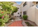 Inviting condo exterior with desert landscaping and a charming walkway at 7800 E Lincoln Dr # 1035, Scottsdale, AZ 85250