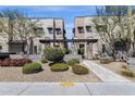Contemporary home exteriors with desert landscaping, trees, and pedestrian walkway at 8340 E Mcdonald Dr # 1016, Scottsdale, AZ 85250