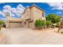 Spacious home featuring a three-car garage and well-maintained exterior at 1074 E Carla Vista Ct, Gilbert, AZ 85295