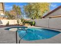 Sparkling pool with desert landscaping and a peaceful atmosphere in the backyard at 10809 N 111Th Pl, Scottsdale, AZ 85259