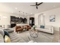 Open-concept living space featuring a comfortable sofa and stylish decor at 12031 S 184Th Ave, Goodyear, AZ 85338
