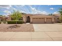 Charming single-story home with a three-car garage and well-maintained desert landscaping at 1211 W Hawken Way, Chandler, AZ 85286