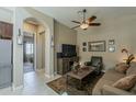 Cozy living room with neutral tones, ceiling fan and view to the next room at 1367 S Country Club Dr # 1189, Mesa, AZ 85210