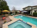 Stunning backyard pool with a built-in spa and a spacious patio area for outdoor gatherings at 15418 W Surrey Dr, Surprise, AZ 85379