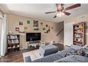 Cozy living room with a ceiling fan, wall decor, and comfortable furnishings at 1645 W Baseline W Rd # 2032, Mesa, AZ 85202