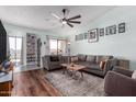 Cozy living room with hardwood floors and lots of natural light from the large sliding glass doors at 16739 E El Lago Blvd # 202, Fountain Hills, AZ 85268
