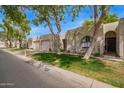 Charming single-story home showcasing a well-manicured lawn and inviting curb appeal at 18725 N 92Nd Dr, Peoria, AZ 85382
