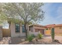 Attractive home exterior featuring desert landscaping, native trees and shrubbery, and a brick driveway at 1904 N Steele --, Mesa, AZ 85207