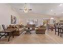 Spacious living room with vaulted ceilings, neutral colors, and comfortable seating at 22300 N Kingston Dr, Maricopa, AZ 85138