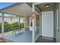 Charming front porch with a seating area and a welcoming entrance at 2400 E Baseline Ave # 94, Apache Junction, AZ 85119