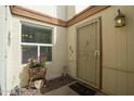Cozy front door entrance with custom details and manicured landscaping at 2434 W Eugie Ave, Phoenix, AZ 85029