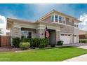Attractive two-story home showcasing the manicured lawn and beautiful stone accents at 3749 E Sagebrush St, Gilbert, AZ 85296