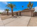 A charming single-story home with a spacious driveway and desert landscaping at 4445 E Coconino St, Phoenix, AZ 85044