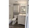 Cozy bathroom featuring a vanity with storage, a shower-tub combo, and modern fixtures at 461 W Holmes Ave # 374, Mesa, AZ 85210