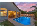 Inviting backyard pool area with covered patio, perfect for outdoor entertaining at 735 W Ivanhoe St, Gilbert, AZ 85233