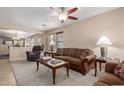 Comfortable living room featuring neutral walls, ceiling fan, and a cozy carpet, perfect for relaxation at 749 E Desert Moon Trl, San Tan Valley, AZ 85143