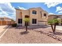Two-story home featuring low-water landscaping with small palm trees at 8341 W Palo Verde Ave, Peoria, AZ 85345