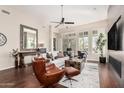 Bright and airy living room featuring hardwood floors, a modern fireplace, and ample natural light at 9270 E Thompson Peak Pkwy # 315, Scottsdale, AZ 85255