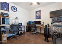 Functional bedroom with multiple monitors, a comfortable chair, and workout equipment creating a multipurpose space at 10221 W Puget Ave, Peoria, AZ 85345