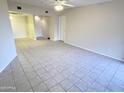 Spacious living room featuring neutral tones and tile flooring for a clean and modern look at 12222 N Paradise Village S Pkwy # 409, Phoenix, AZ 85032