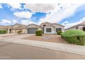 Inviting single-story home featuring a neat front yard and attached two-car garage at 1289 E Baker Dr, San Tan Valley, AZ 85140