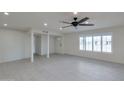 Bright living space featuring light tile floors, modern lighting, and neutral paint, creating a welcoming atmosphere at 1410 W Morrow Dr, Phoenix, AZ 85027